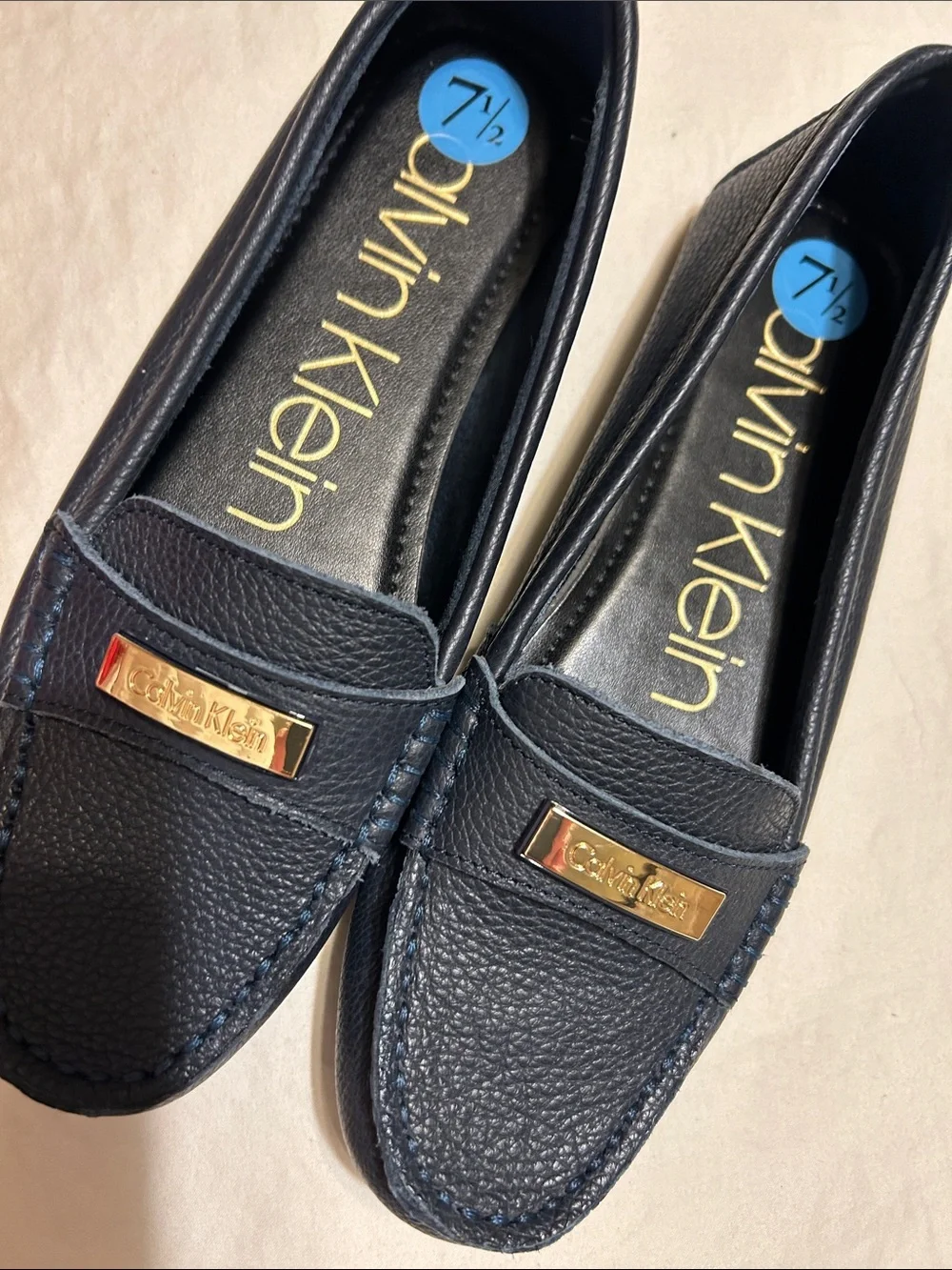 Calvin Klein Women's Navy Leather Moccasin Loafers with Gold Plaque